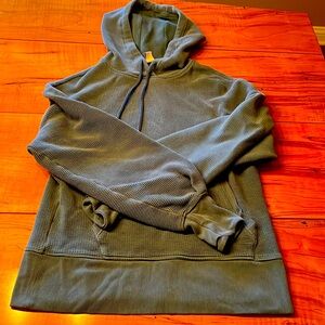 Athleta women’s blue green hooded sweatshirt; front pocket and thumb holes